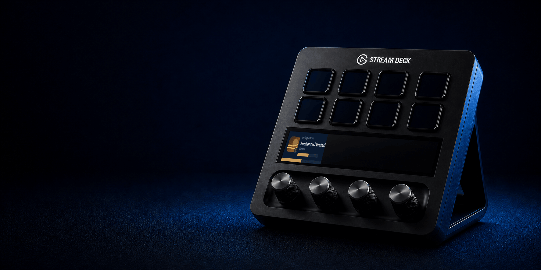 A Stream Deck+ facing left with the Now Playing Sonos track view and active media dial
